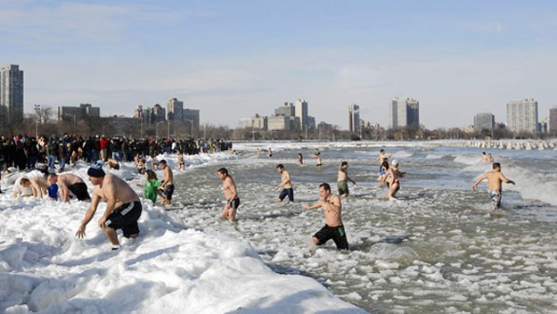 People swimming in ice water