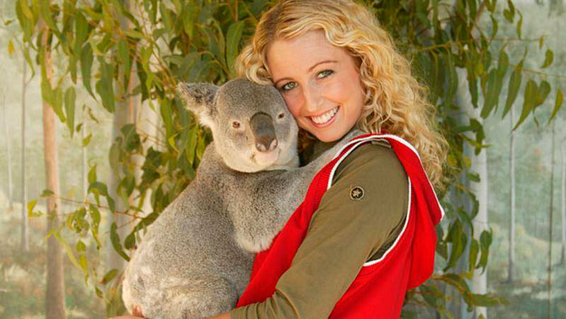 Woman cuddles with Koala