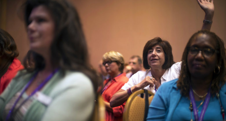 An audience member raises her hand to field a question to the 18th Chairman of the Joint Chiefs of Staff Gen. Martin E. Dempsey and his wife Deanie during the 2013 Military Child Education Coalition National Training Seminar at the Gaylord National Resort and Convention Center in Fort Washington, Md., July 8, 2013. The goal of the event's host, the Military Child Education Coalition, is to work with leading national experts in child development, education and health to support the nation's youngest heroes: children who serve on the home front. DoD photo by Mass Communication Specialist 1st Class Daniel Hinton